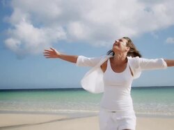 Woman spinning on beach Stock Footage