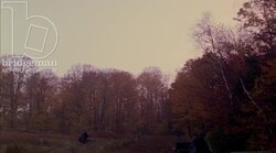 Man and boy riding a bicycle in the countryside, 1908 - reenactment Stock Footage