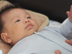 Baby playing with mother Stock Footage