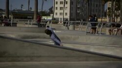 teenager skating in pool at venice California skatepark Stock Footage