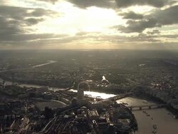 Aerial W/S late afternoon autumn god-rays over South West London Stock Footage