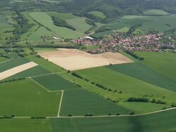 WS AERIAL View of Gorbachev gate near Ecklingerode with farmland and small town / Germany Stock Footage