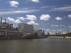 WS T/L View of river with old industrial buildings and Moscow Kremlin / Moscow, Russia Stock Footage