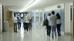 Young adult students bullying another student at school Stock Footage