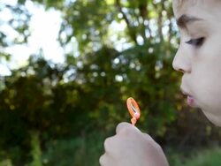 Girl trying to blow a bubble Stock Footage