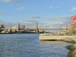 WS View of Pepsi-Cola sign on East River with Queensboro Bridge in background / New York City, New York, USA   Stock Footage