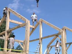 WS Carpenters at working while framing an energy efficient post / Grass Lake, Michigan, USA       Stock Footage