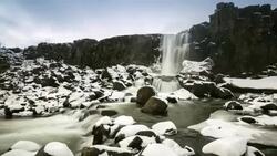 HD Time-lapse: Oxararfoss Waterfall winter Pingvellir National Park Iceland Stock Footage