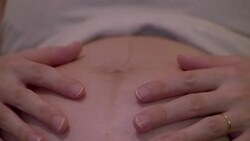 CU,Hands of pregnant woman caressing her belly. Stock Footage
