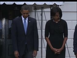 President Barack Obama and first lady Michelle Obama observed a moment of silence in honor of 9/11 victims outside the White House as a single bugler played taps. News Clip
