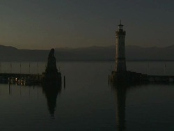 WS T/L View of Lindau harbour entrance and lighthouse at sunrise on Lake Constance / Lindau, Bavaria, Germany  Stock Footage