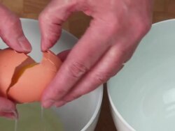 HD Separating Organic Egg Close-up (4:2:2@100 Mb/s) Stock Footage