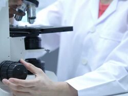 Scientist using microscope Stock Footage