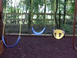 Empty Swings on a playground Stock Footage