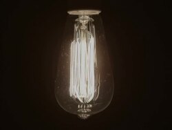 Idea Concept Vintage light bulb turns on and off slowly Stock Footage