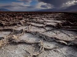 WS LA POV Dry Cracked Earth and Salt Flats / Death Valley NP, California, United States  Stock Footage