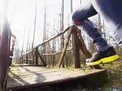 HD SUPER SLOW-MO: Athlete Running Across A Bridge Stock Footage