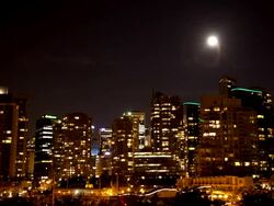 WS T/L View of Moon over downtown Vancouver / Cortes, British Columbia, Canada   Stock Footage