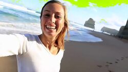Young woman takes a selfie portrait on Gibsons steps beach Stock Footage