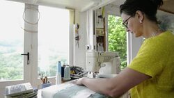 Woman sewing on machine Stock Footage