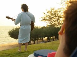 play guitar on the beach Stock Footage