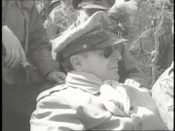 U.S. General Douglas MacArthur wears his full uniform, scarf and sunglasses. News Clip