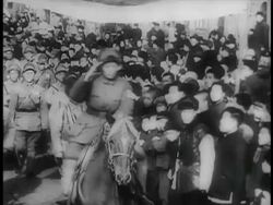 B/W 1949 soldier on horse riding past crowd in parade saluting / China / educational Stock Footage