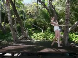 MS Ballerina dancer dancing in point shoes on wooden stage surrounded by palm trees / Montezuma, Nicoya Peninsula, Costa Rica Stock Footage