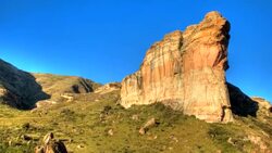A shadow moves across the face of sandstone cliffs in the setting sun. Stock Footage