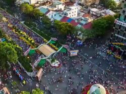 WS T/L HA View over People enjoying flower decorations during Tet (lunar new year) / Ho Chi Minh City, Southeastern, Vietnam Stock Footage