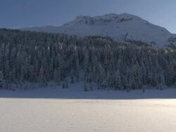 mountain lake and landscape changing seasons from fall to winter Stock Footage