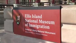 ATMOSPHERE - guests and signage at Bono and Yoko Ono honor John Lennon at Event on Ellis Island Stock Footage