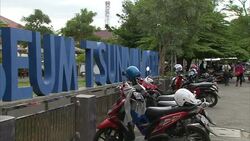 Visitors outside the Aceh Tsunami Museum News Clip