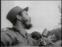 B/W 1959 close up PROFILE Fidel Castro enthusiastically giving speech outdoors / post-revolution Havana Stock Footage