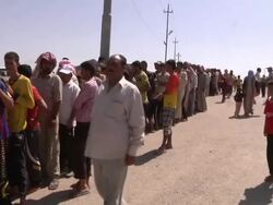 Yazidi Refugees Wait for Food Aid News Clip