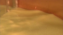 Whisks stir a cheese mixture. Stock Footage