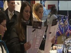 While New York Giants-themed apparel is moving off shelves at stores, the team returns home to the cheers of crowds at the airport. The Giants defeated the New England Patriots in the Super Bowl. News Clip