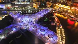 Ornate lights decorate the Entertainment district of Clarke Quay on the Singapore River. Stock Footage