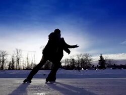 Young adult couple skating together. Stock Footage