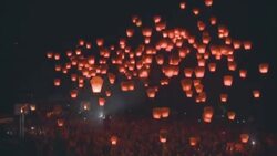 Paper lanterns float skyward during a festival in Pingshi, Taipei. Stock Footage