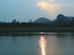 Sunset over ripple water. Stock Footage