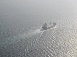 aerial view of bulk carrier steaming into the sun in the Atlantic Ocean Stock Footage
