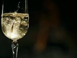 HD Super Slow-Mo: Wedding Rings In Glass Of Champagne Stock Footage