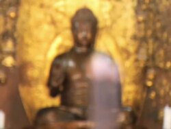 MS RF Sizzling incense stick in front of buddha statue in temple / Gaya, Bihar, India Stock Footage