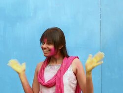 Portrait of a young woman celebrating holi festival Stock Footage