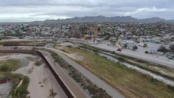US Mexican border fence at El Paso aerials News Clip