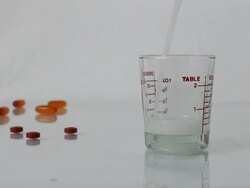 Pouring medicine. Stock Footage