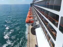 MS Side POV View of Cruise ship Queen Mary 2 of Cunard Line with small boat / North Sea, Jutland, Denmark Stock Footage