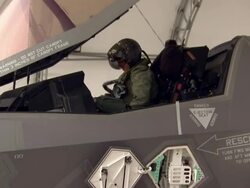 F-35 pilot climbing into cockipt of fighter jet News Clip