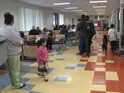 2009 WS People waiting in line and children playing in job center office/ Antioch, Calfornia, USA/ AUDIO Stock Footage
